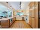 Bright kitchen features tile flooring, a large center island, and stainless steel appliances at 319 W Margaret Ln, Hillsborough, NC 27278