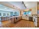 Spacious kitchen with tile flooring, a large center island, and stainless steel appliances at 319 W Margaret Ln, Hillsborough, NC 27278
