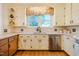 Bright kitchen featuring tile flooring, bright white cabinetry, and stainless steel appliances at 319 W Margaret Ln, Hillsborough, NC 27278