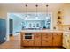 Spacious kitchen with tile flooring, a large center island, and pendant lighting at 319 W Margaret Ln, Hillsborough, NC 27278