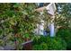 Lush landscaping surrounds the house with mature flowering trees and manicured shrubs at 319 W Margaret Ln, Hillsborough, NC 27278