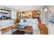Open-concept living area with hardwood floors, comfortable seating, and seamless flow to the kitchen at 319 W Margaret Ln, Hillsborough, NC 27278