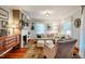 Bright living room featuring a fireplace, comfortable seating, and hardwood floors at 319 W Margaret Ln, Hillsborough, NC 27278