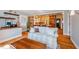 Inviting living space showcasing hardwood floors, neutral decor, and an open view to the kitchen at 319 W Margaret Ln, Hillsborough, NC 27278