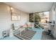 Relaxing screened porch with comfortable seating and blue wood flooring at 319 W Margaret Ln, Hillsborough, NC 27278