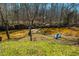 Tranquil river view from a grassy lawn with two blue Adirondack chairs at 319 W Margaret Ln, Hillsborough, NC 27278