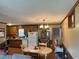 Bright kitchen and dining area featuring wood cabinetry, and ample counter space at 322 Blackstone Rd, Sanford, NC 27330