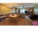 Spacious living area offering a kitchen view, a wood-burning stove, and a dining area at 322 Blackstone Rd, Sanford, NC 27330