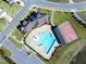 Aerial view of a swimming pool and a basketball court within a community setting at 3460 Willow Green Dr, Apex, NC 27502