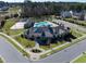 Aerial view of a neighborhood clubhouse with a pool, basketball court and green space at 3460 Willow Green Dr, Apex, NC 27502