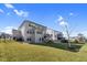A well-maintained backyard featuring green grass, a black fence, and a multi-level deck at 3460 Willow Green Dr, Apex, NC 27502