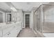 Elegant primary bathroom with double vanities, a glass-enclosed shower, and an alcove tub at 3460 Willow Green Dr, Apex, NC 27502