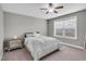 This bedroom offers a ceiling fan, carpeted floors, and natural light at 3460 Willow Green Dr, Apex, NC 27502