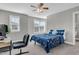 This bedroom features carpet floors, ceiling fan, and natural light from the windows at 3460 Willow Green Dr, Apex, NC 27502