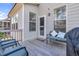 Cozy outdoor deck area with comfortable seating, a grill, and access to the home's interior at 3460 Willow Green Dr, Apex, NC 27502
