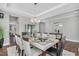 Elegant dining room with a modern table set for a dinner party at 3460 Willow Green Dr, Apex, NC 27502