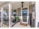 Inviting front porch with seating, decorative accents, and a 'Welcome' sign at 3460 Willow Green Dr, Apex, NC 27502