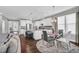 Modern kitchen with white cabinets, granite countertops, and stainless steel appliances at 3460 Willow Green Dr, Apex, NC 27502