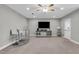 Open living room with TV, bar, and lots of room for entertaining at 3460 Willow Green Dr, Apex, NC 27502