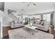 Open-concept living space flowing into a modern kitchen and staircase, perfect for entertaining at 3460 Willow Green Dr, Apex, NC 27502