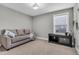 Cozy living room space offers a comfortable couch, natural light and room to entertain at 3460 Willow Green Dr, Apex, NC 27502
