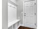 Functional mud room with built-in bench, storage, and a convenient entrance to the home at 3460 Willow Green Dr, Apex, NC 27502