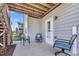Comfortable outdoor patio with chairs and door to the main house at 3460 Willow Green Dr, Apex, NC 27502