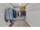 Spacious walk-in closet with ample storage, wire shelving, and carpet at 3460 Willow Green Dr, Apex, NC 27502