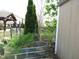 A backyard offers garden beds and features lush landscaping at 401 Lawton Dr, Haw River, NC 27258