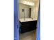 Bathroom featuring double sinks with modern vanity and large mirror at 401 Lawton Dr, Haw River, NC 27258