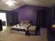 This bedroom features carpet, a ceiling fan, and large windows with stylish curtains at 401 Lawton Dr, Haw River, NC 27258