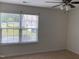 This cozy bedroom features a window letting in natural light and a ceiling fan at 401 Lawton Dr, Haw River, NC 27258