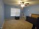 Bright bedroom with blue walls and ceiling fan at 401 Lawton Dr, Haw River, NC 27258