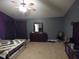 Spacious carpeted bedroom featuring a dark wood dresser at 401 Lawton Dr, Haw River, NC 27258