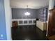 Dining room features chair railings and black hardwood floors at 401 Lawton Dr, Haw River, NC 27258