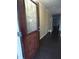 Entryway features hardwood floors, dark wood door and tan walls at 401 Lawton Dr, Haw River, NC 27258