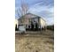 Well-manicured lawn surrounds this charming two-story home with stone accents and two-car garage at 401 Lawton Dr, Haw River, NC 27258