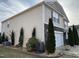 Two-story home featuring stone accents, vinyl siding, and an attached two-car garage at 401 Lawton Dr, Haw River, NC 27258