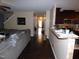 Hallway view showing the transition from the living area to the kitchen and front entrance at 401 Lawton Dr, Haw River, NC 27258