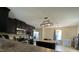 Kitchen featuring an island, stainless steel appliances, and dark wood cabinets at 401 Lawton Dr, Haw River, NC 27258