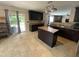 Spacious kitchen featuring dark cabinets, center island, and open view to the living room at 401 Lawton Dr, Haw River, NC 27258