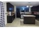 Spacious kitchen features dark cabinets, an island and an eat-in area at 401 Lawton Dr, Haw River, NC 27258