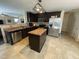 Modern kitchen with a stainless steel dishwasher, island and stainless steel refrigerator at 401 Lawton Dr, Haw River, NC 27258