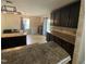 View of kitchen featuring granite countertops, island, and stainless steel appliances at 401 Lawton Dr, Haw River, NC 27258