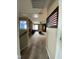 Living room features wood wall, and view to blue room at 401 Lawton Dr, Haw River, NC 27258