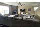 Cozy living room featuring a stone fireplace and a large sectional sofa at 401 Lawton Dr, Haw River, NC 27258