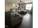Spacious living room with hardwood floors and oversized couch for comfortable entertaining at 401 Lawton Dr, Haw River, NC 27258