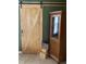 View of a wooden door and a cabinet, with an American flag on display at 401 Lawton Dr, Haw River, NC 27258