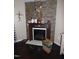 Cozy living room with a fireplace and decorative deer head mount at 401 Lawton Dr, Haw River, NC 27258