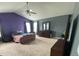 Spacious main bedroom with high ceilings, neutral carpet and purple accent wall at 401 Lawton Dr, Haw River, NC 27258